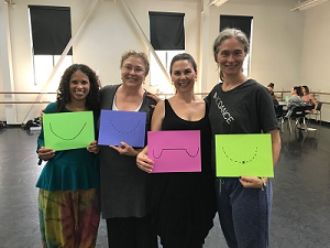 photo of 4 LOD Module C participants each holding a relating symbol.